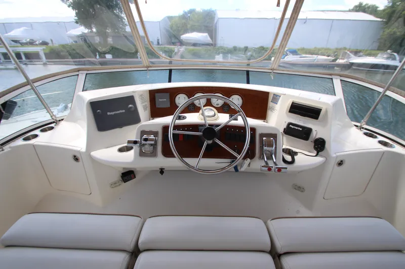 Slide: The Image of Helm of 2006 Silverton 38 Sport Bridge yacht with steering wheel and navigation instruments. - 35