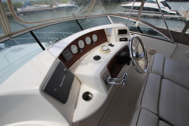 Slide: The Image of Helm of 2006 Silverton 38 Sport Bridge yacht with steering wheel and navigation instruments. - 37