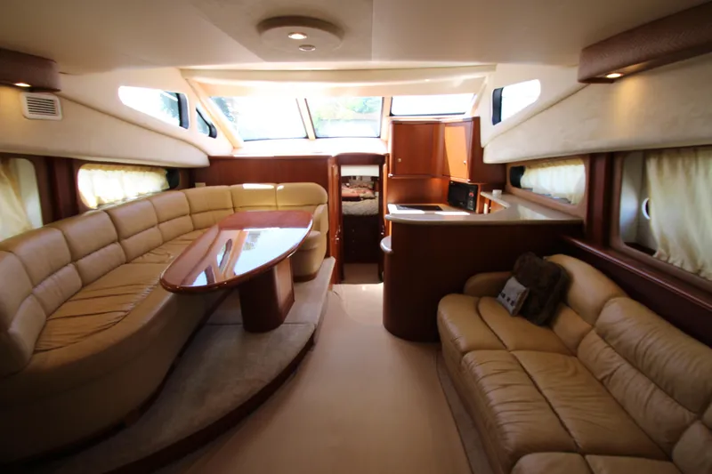 Slide: The Image of Luxurious interior of a 2006 Silverton 38 Sport Bridge yacht with plush seating and elegant design. - 4