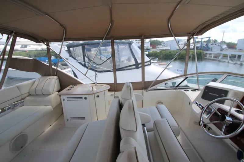 Slide: The Image of Interior view of 2006 Silverton 38 Sport Bridge yacht with luxurious seating and helm. - 41