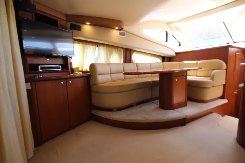Slide: The Image of Luxurious interior of a 2006 Silverton 38 Sport Bridge yacht with plush seating and entertainment area. - 5