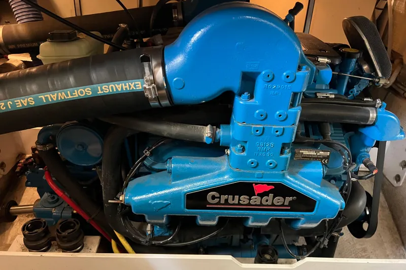 Slide: The Image of Engine of a 2006 Silverton 38 Sport Bridge boat, featuring a Crusader motor. - 51