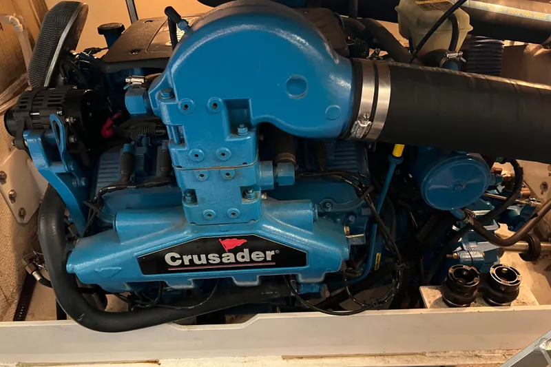 Slide: The Image of Engine of a 2006 Silverton 38 Sport Bridge boat, featuring a Crusader motor. - 53