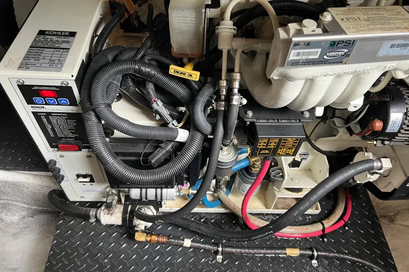 Slide: The Image of Engine compartment of a 2006 Silverton 38 Sport Bridge with Kohler generator and wiring. - 58