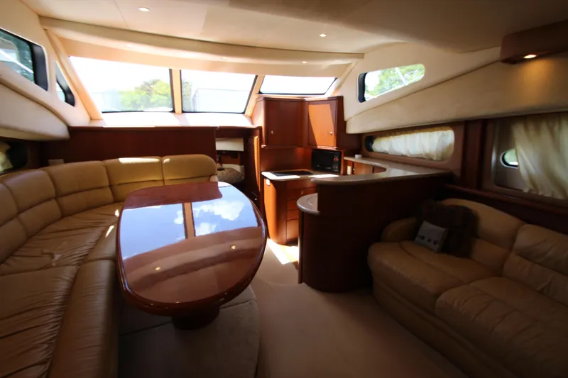 Slide: The Image of Luxurious interior of 2006 Silverton 38 Sport Bridge yacht with elegant seating and dining area. - 8