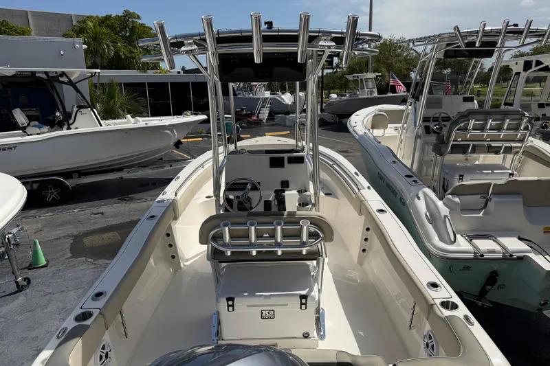 Slide: The Image of 2026 Key West 203 FS boat with center console and seating, displayed outdoors. - 25