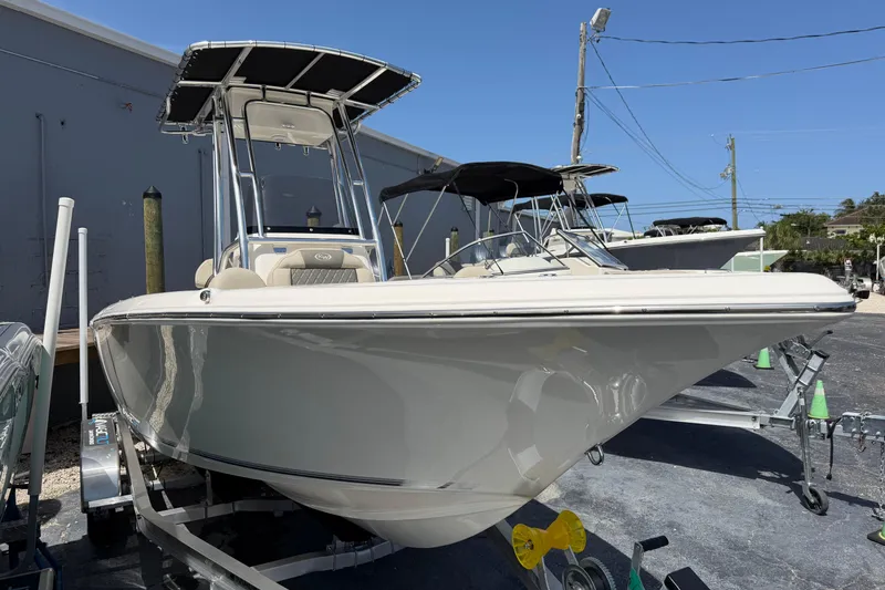 Slide: The Image of 2026 Key West 203 FS boat on trailer, parked outdoors. - 3