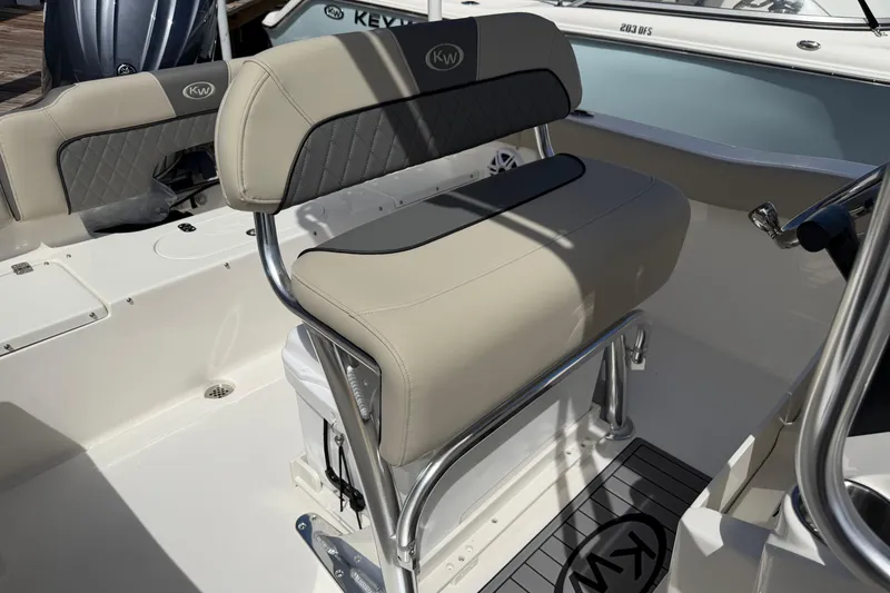 Slide: The Image of 2026 Key West 203 FS boat interior with cushioned seating and stainless steel frame. - 20