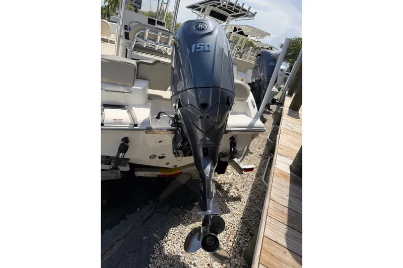 Slide: The Image of 2026 Key West 203 FS boat with Yamaha 150 outboard motor docked. - 5