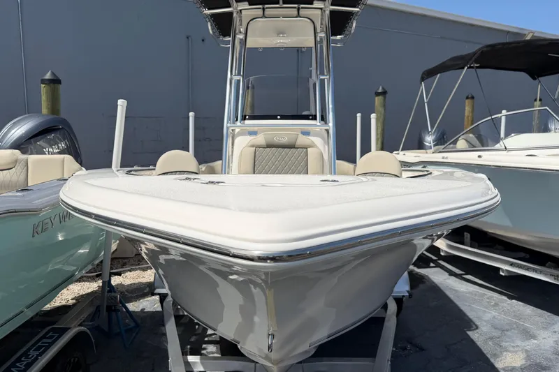 Slide: The Image of 2026 Key West 203 FS boat displayed in a showroom, featuring sleek design and modern amenities. - 4