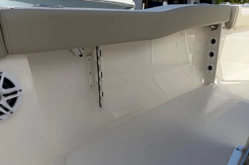 Slide: The Image of Interior view of 2026 Key West 203 FS boat, featuring seating and speaker. - 31