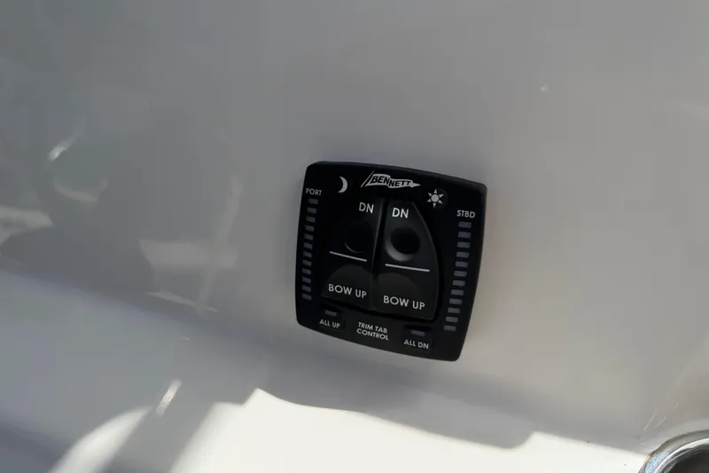 Slide: The Image of Trim tab control panel on 2026 Key West 203 FS boat. - 23
