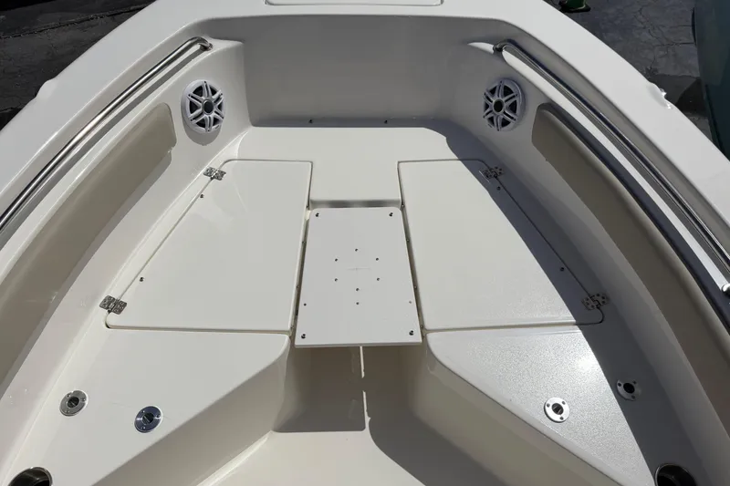 Slide: The Image of 2026 Key West 203 FS boat interior with storage compartments and speakers. - 19