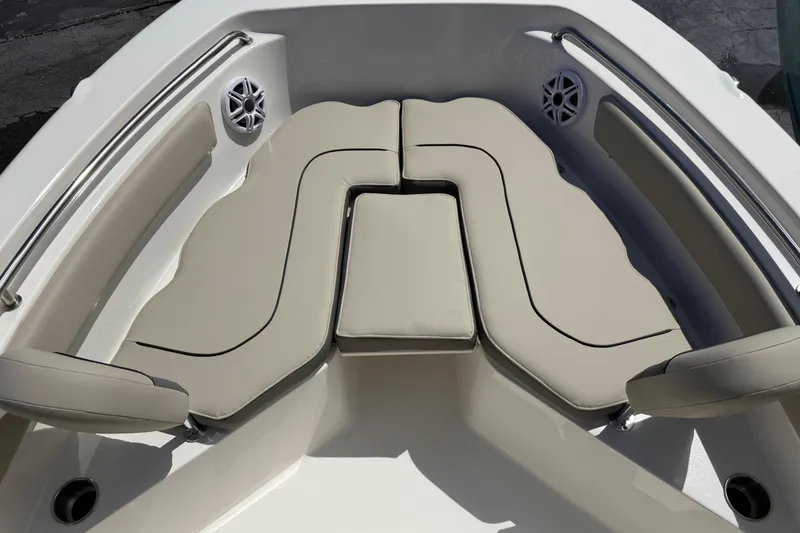 Slide: The Image of Bow seating area of 2026 Key West 203 FS boat with beige cushions and speakers. - 17