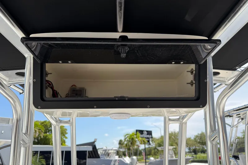 Slide: The Image of Open storage compartment on 2026 Key West 203 FS boat, showcasing interior space. - 24