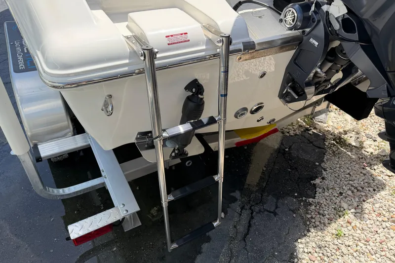 Slide: The Image of Rear view of 2026 Key West 203 FS boat with ladder and motor. - 8