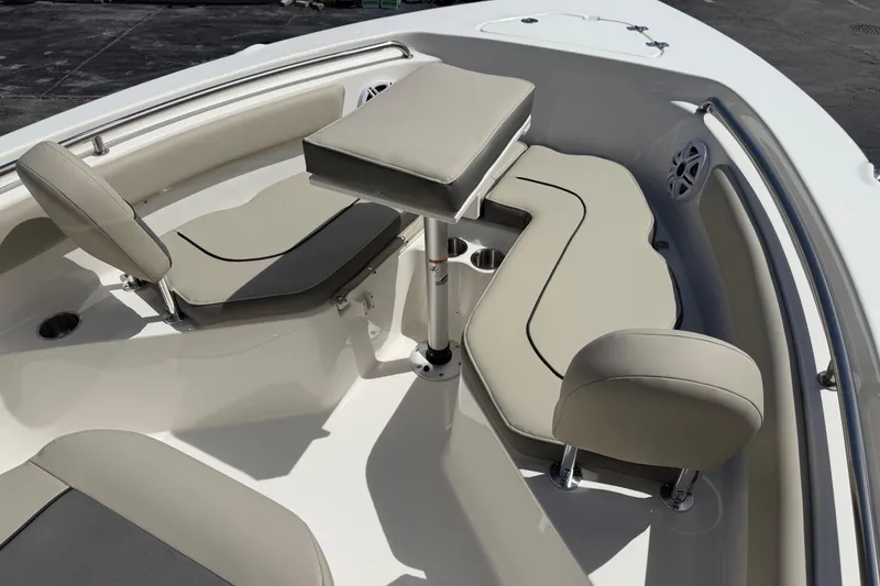 Slide: The Image of 2026 Key West 203 FS boat interior with beige seating and table. - 18