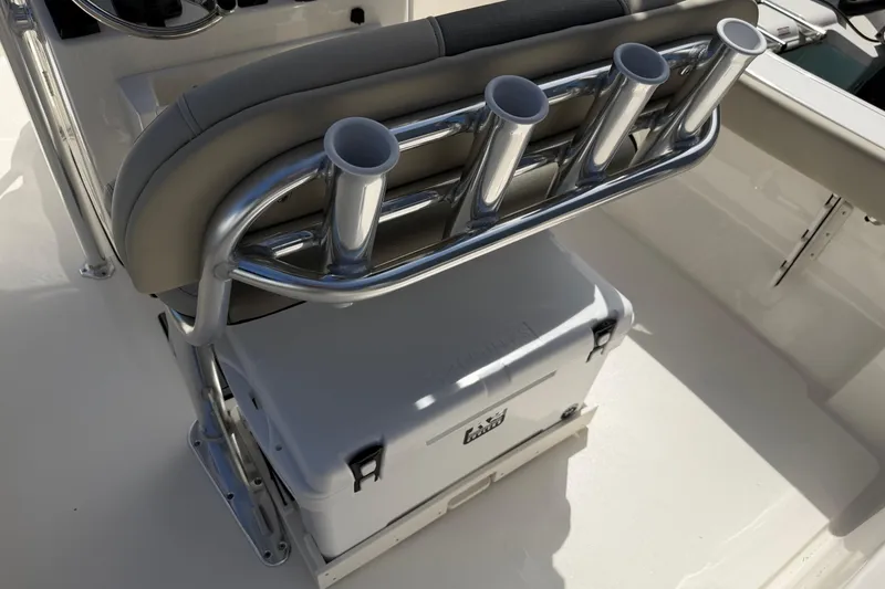 Slide: The Image of Key West 203 FS 2026 boat seat with rod holders and cooler storage. - 27