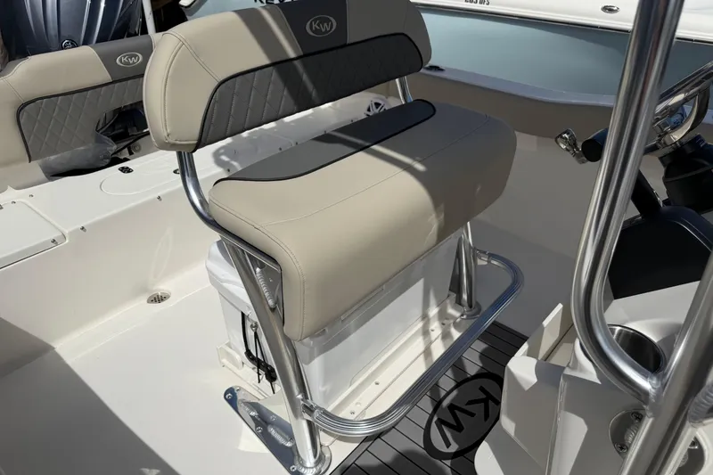 Slide: The Image of 2026 Key West 203 FS boat interior with cushioned seating and stainless steel frame. - 21