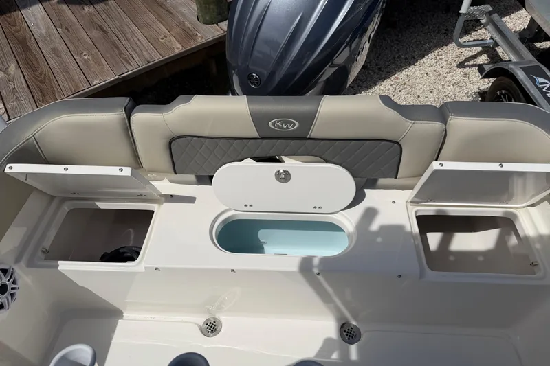 Slide: The Image of Key West 203 FS 2026 boat interior with storage compartments and seating. - 12