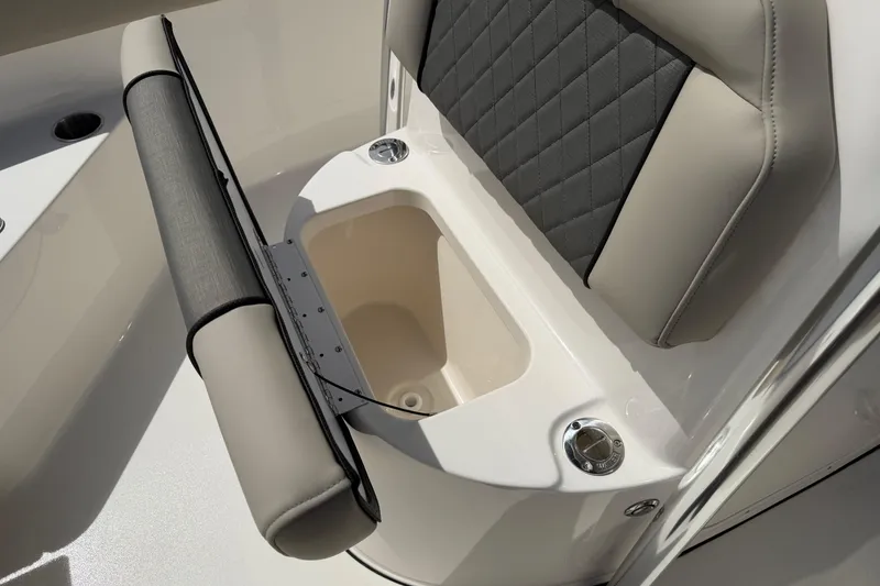 Slide: The Image of 2026 Key West 203 FS boat seat with storage compartment and cup holders. - 15