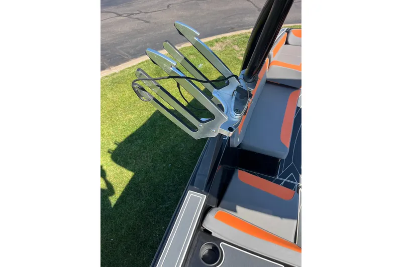 Slide: The Image of 2018 Heyday WT-2 boat with wakeboard rack and orange-accented seating. - 21