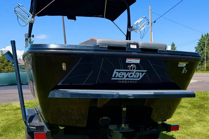 Slide: The Image of 2018 Heyday WT-2 boat on trailer, rear view, sunny day, green grass background. - 5