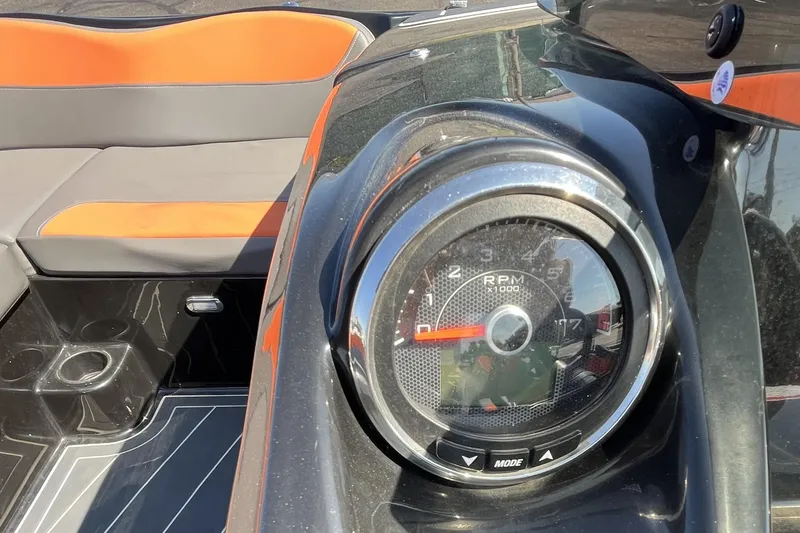Slide: The Image of Close-up of 2018 Heyday WT-2 boat dashboard with RPM gauge and orange seating. - 16