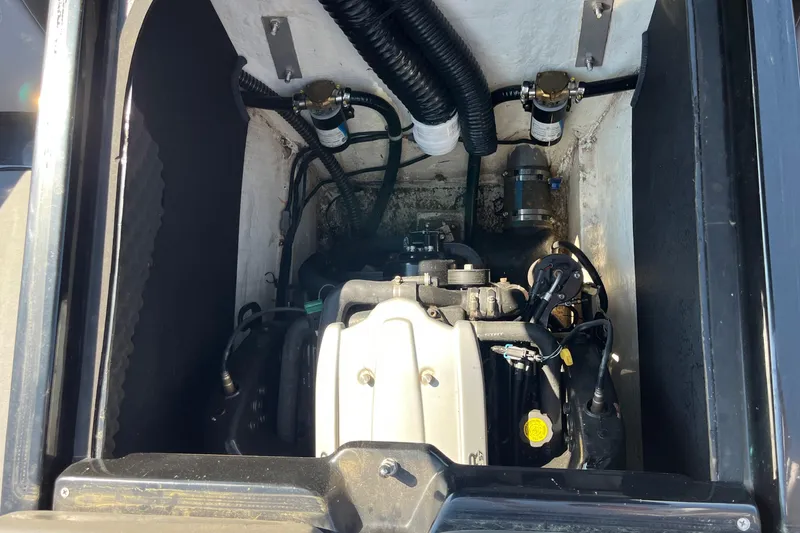 Slide: The Image of Engine compartment of a 2018 Heyday WT-2 boat, showcasing mechanical components and wiring. - 22