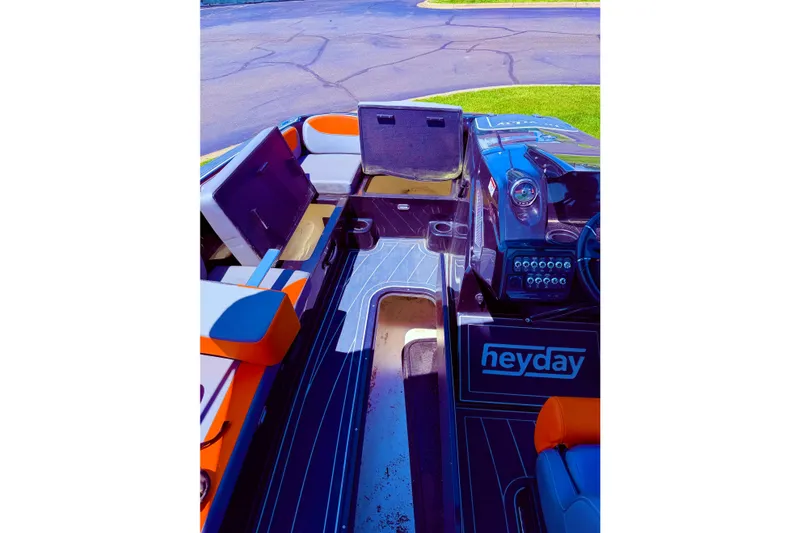 Slide: The Image of Interior of a 2018 Heyday WT-2 boat with seating and dashboard. - 8