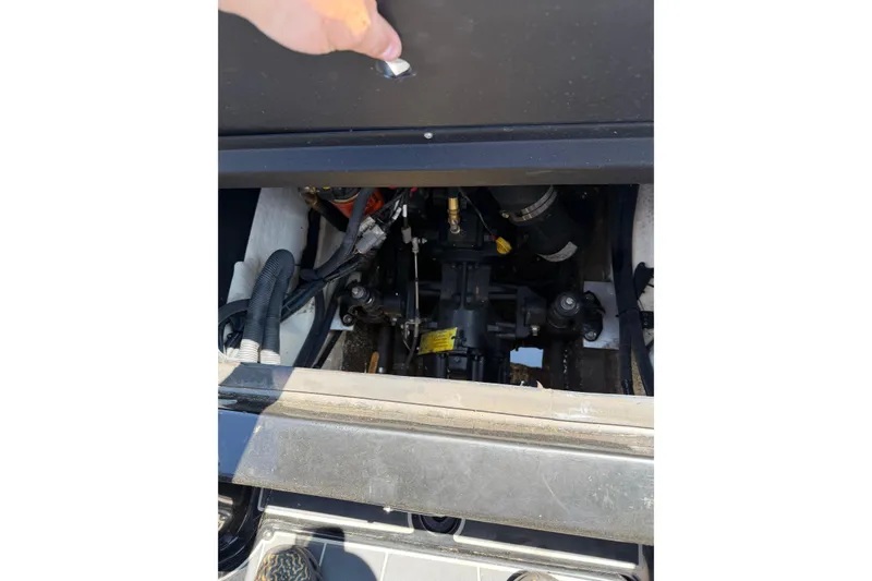 Slide: The Image of Engine compartment of a 2018 Heyday WT-2 boat, showcasing mechanical components and wiring. - 23