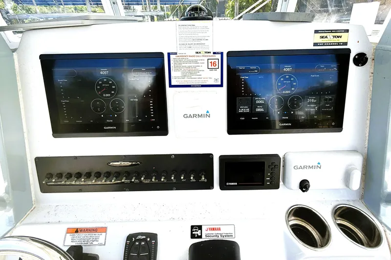 Slide: The Image of Dashboard of 2021 Cobia 280 Center Console with Garmin displays and controls. - 12