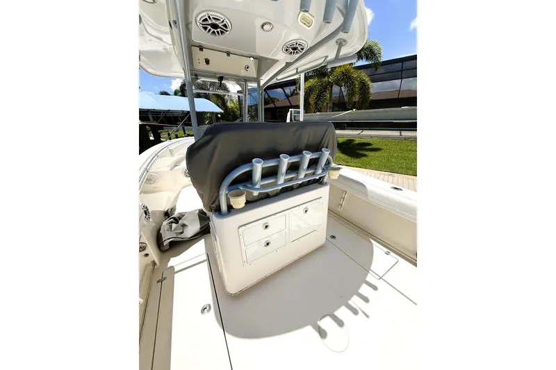 Slide: The Image of 2021 Cobia 280 Center Console boat interior with rod holders and storage compartments. - 5