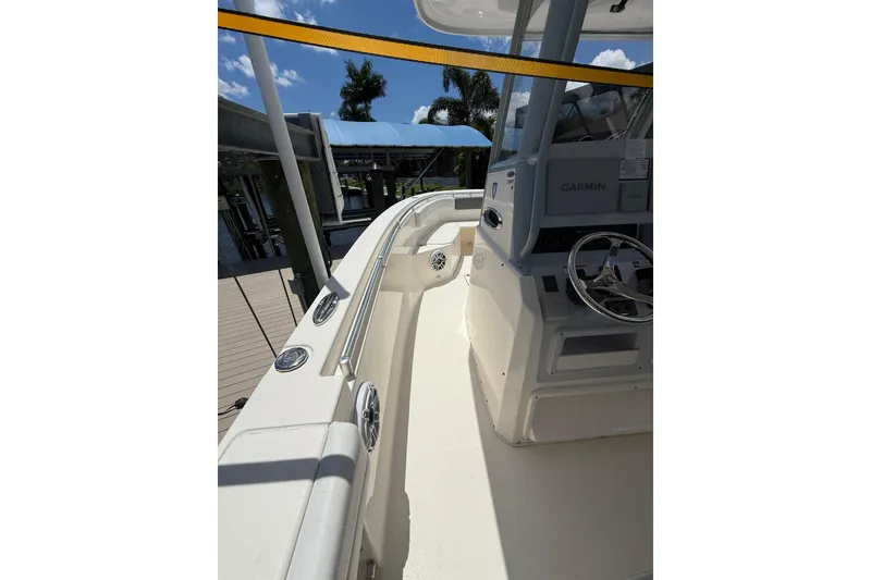 Slide: The Image of 2021 Cobia 280 Center Console boat interior with Garmin navigation system. - 7