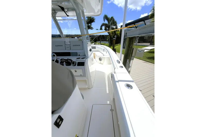 Slide: The Image of 2021 Cobia 280 Center Console boat interior with Garmin navigation systems. - 8