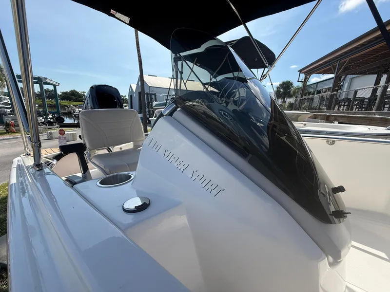 Slide: The Image of The image shows the cockpit of a Boston Whaler 130 Super Sport with a black sunshade. - 7