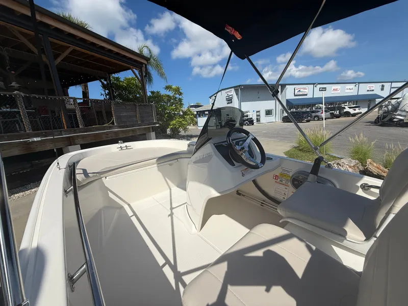 Slide: The Image of The image shows the cockpit of a 2027 Boston Whaler 130 Super Sport with a modern helm. - 8