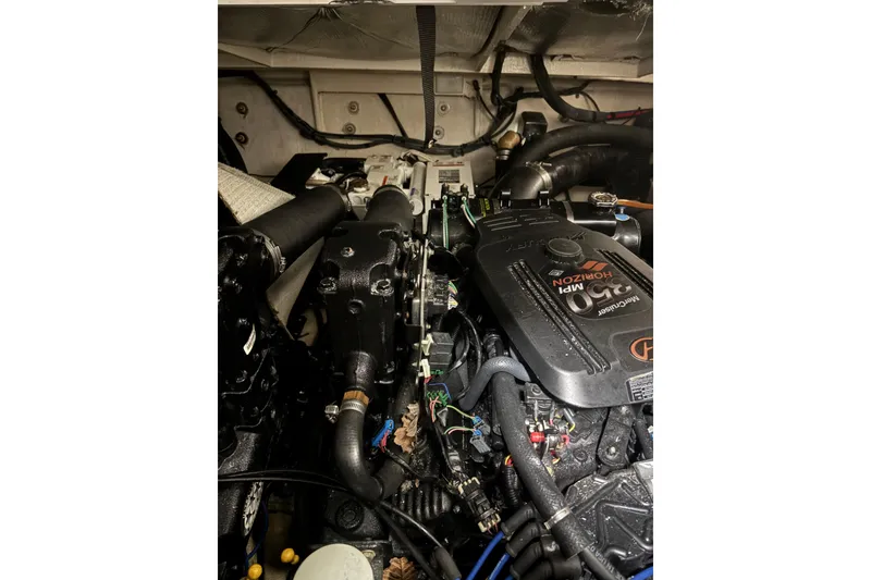 Slide: The Image of Engine compartment of a 2006 Sea Ray Sundancer 320 boat, featuring MerCruiser components. - 18