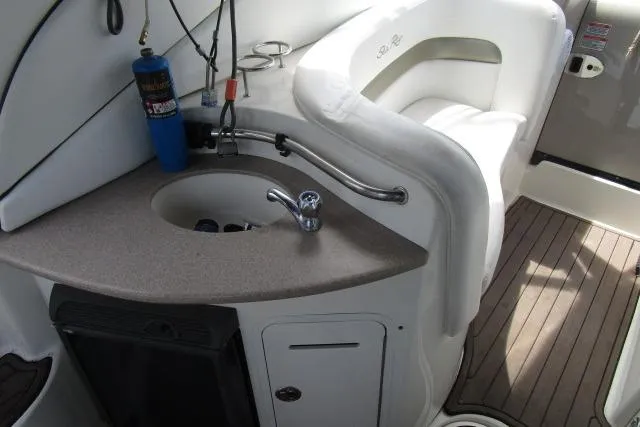 Slide: The Image of 2006 Sea Ray Sundancer 320 interior with sink and seating area. - 7