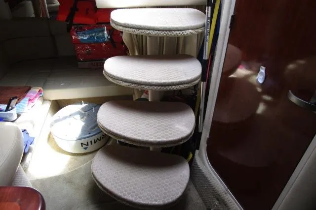 Slide: The Image of Interior stairs of a 2006 Sea Ray Sundancer 320 yacht, featuring carpeted steps. - 17