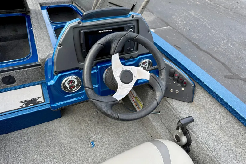 Slide: The Image of Steering console of 2018 Xpress X19 Pro boat with gauges and controls. - 15