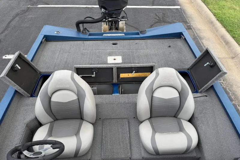 Slide: The Image of Xpress X19 Pro 2018 boat interior with two seats and storage compartments. - 17
