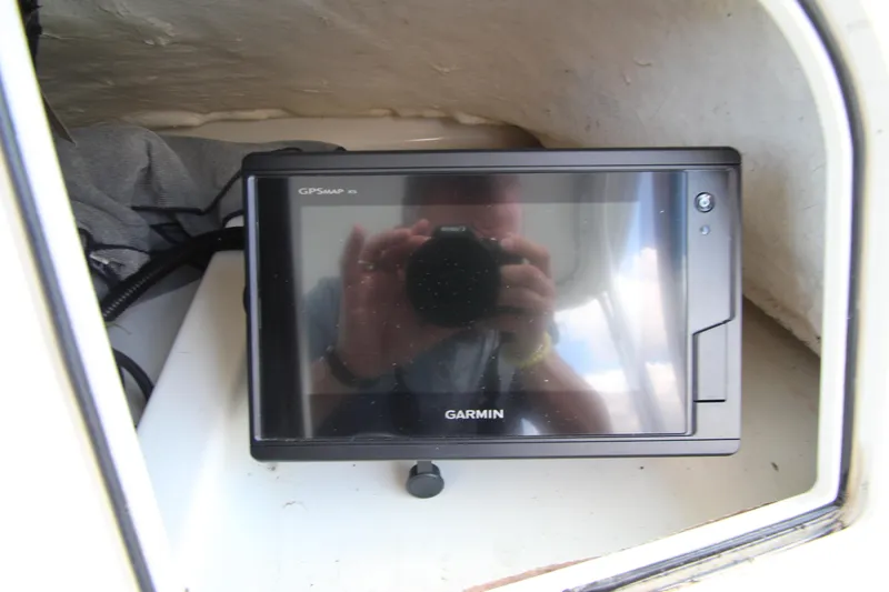 Slide: The Image of Garmin GPS device inside a 2002 Hydra-Sports 230 WA boat cabin. - 24