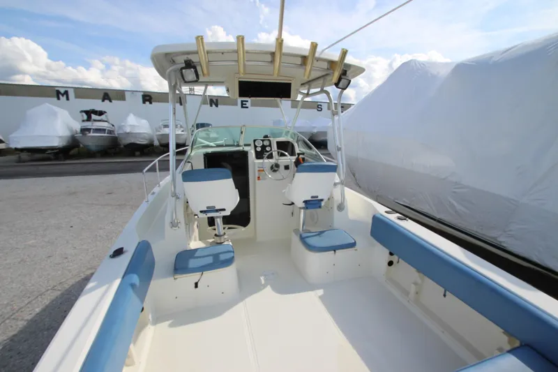Slide: The Image of 2002 Hydra-Sports 230 WA boat interior with blue seating and steering console. - 6