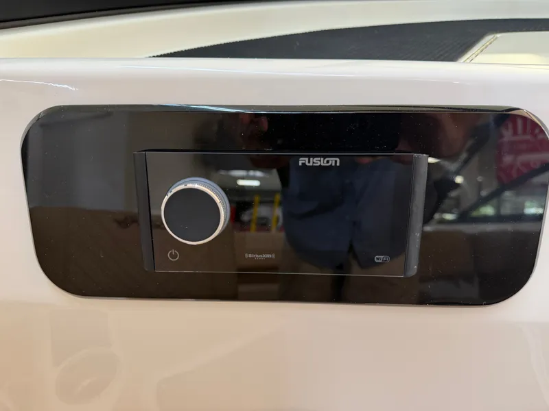 Slide: The Image of Close-up of a Fusion audio system on a Sea Ray SDX 230 boat. - 38