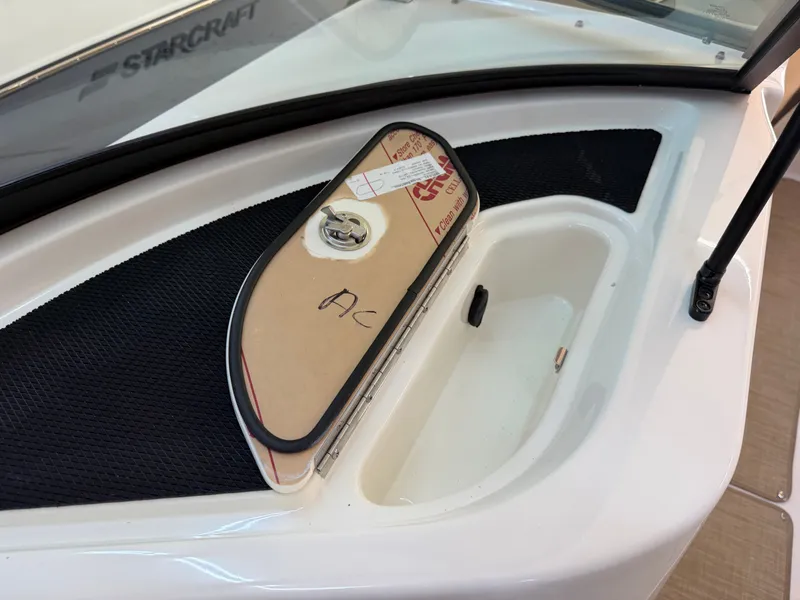Slide: The Image of A detail of the 2026 Sea Ray SDX 230 shows a compartment with a cover. - 40