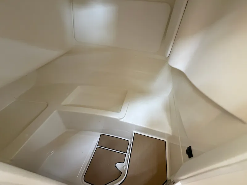 Slide: The Image of Interior of a 2026 Sea Ray SDX 230 with a clean, modern design and wood flooring. - 47