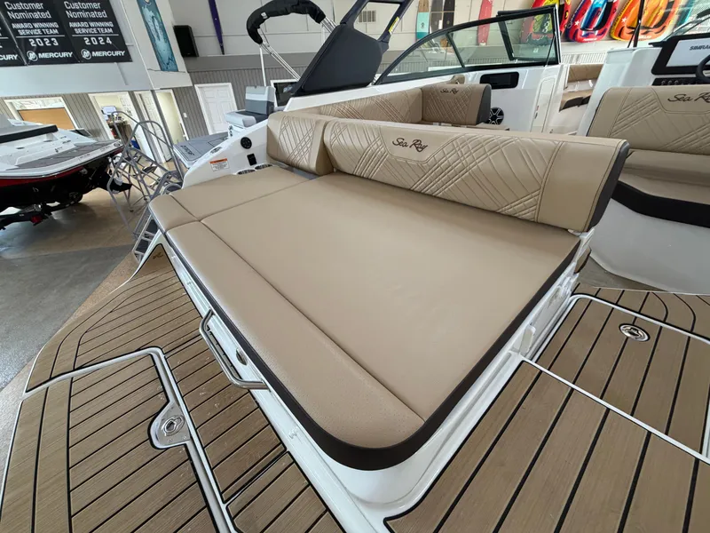 Slide: The Image of The image shows the spacious aft deck of a 2026 Sea Ray SDX 230 with beige upholstery. - 11