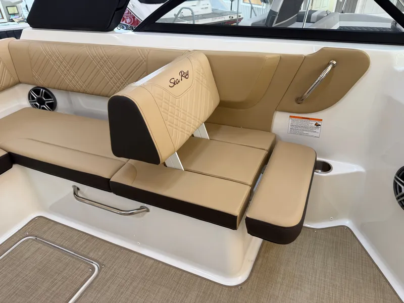 Slide: The Image of The 2026 Sea Ray SDX 230 features elegant beige upholstery with a quilted design. - 35