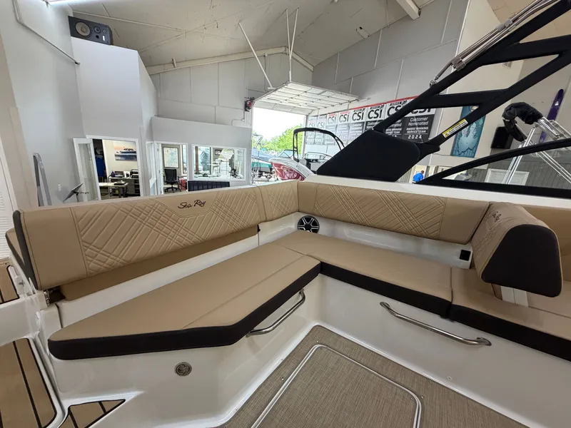 Slide: The Image of Interior view of a Sea Ray SDX 230 boat with beige upholstery and modern design. - 18